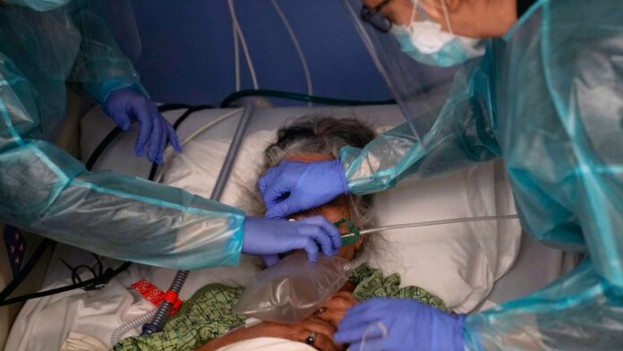 apa_210125_covid_patient_ventilator_nurses_ppe_800x450.jpg